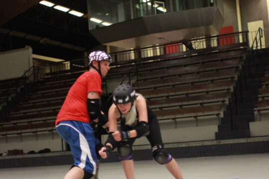 2 roller derby players train together